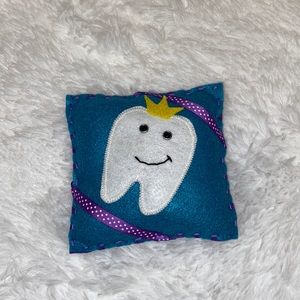 Tooth Fairy Pillow with Tooth wearing crown. Blue/Purple